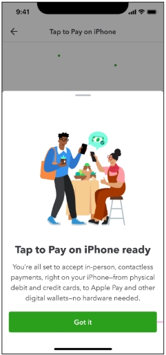A person and person are sitting at a table with a phone.