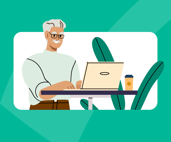 A person sitting at a desk with a laptop computer.