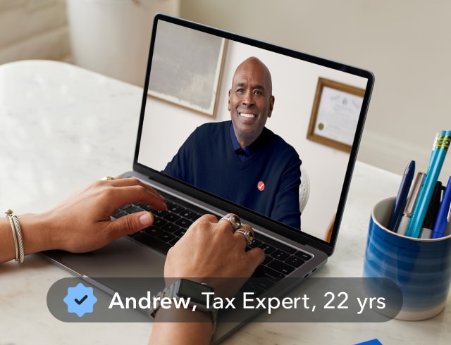 A person on a video call with Andrew, Tax expert, 22 years