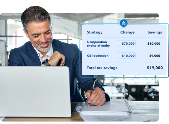 A smiling man in a suit writes in a notebook while looking at a laptop. An overlaid blue graphic displays tax savings strategies, including 'Total tax savings: $19,000'."