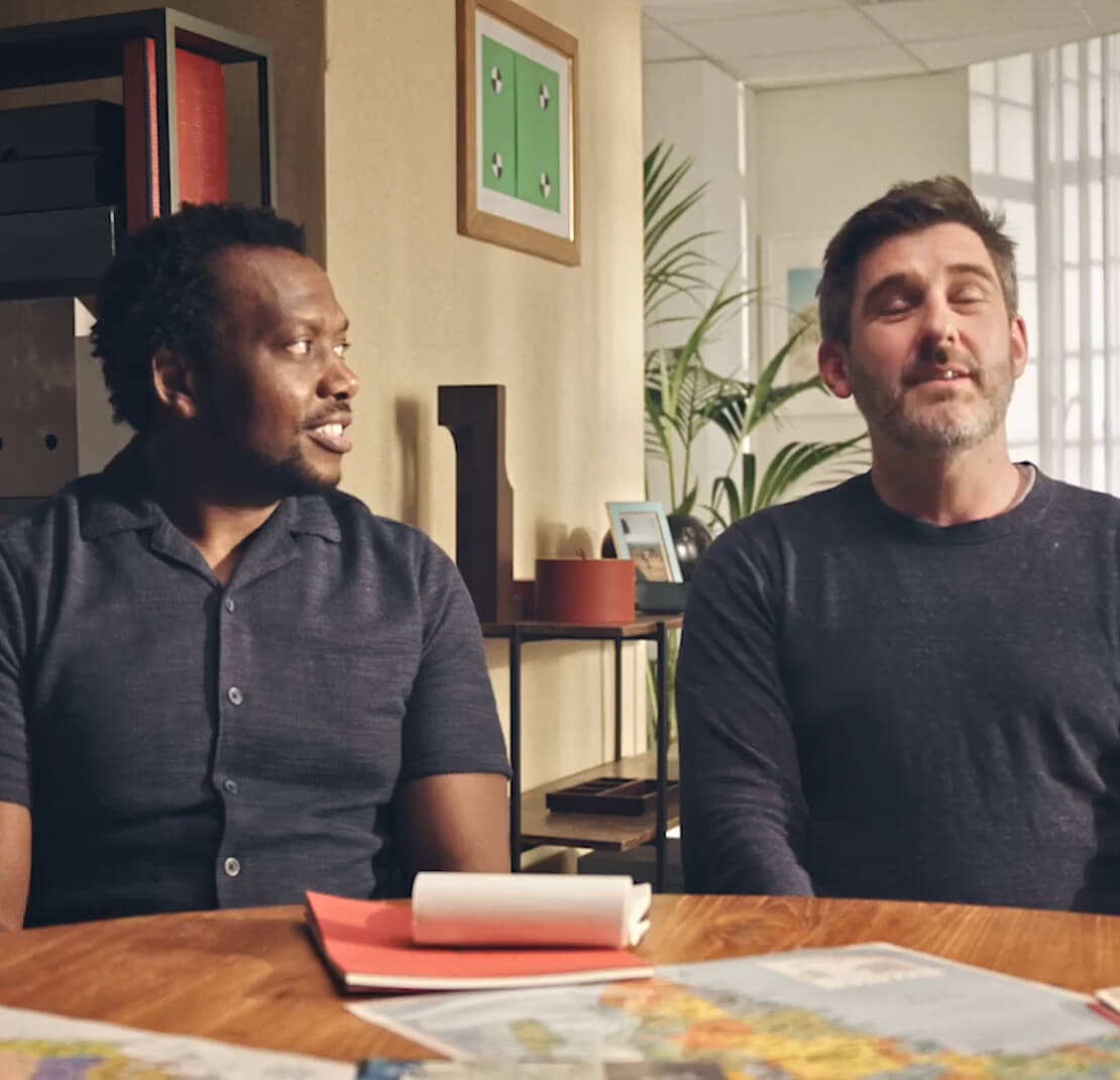Two men in casual office meeting setting