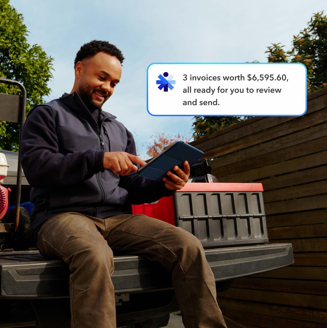 A business owner checking 3 invoices worth $6,595.60 on his tablet
